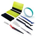 Window tint film kit with neon green/black sheets, teal roll, felt squeegees and tools
