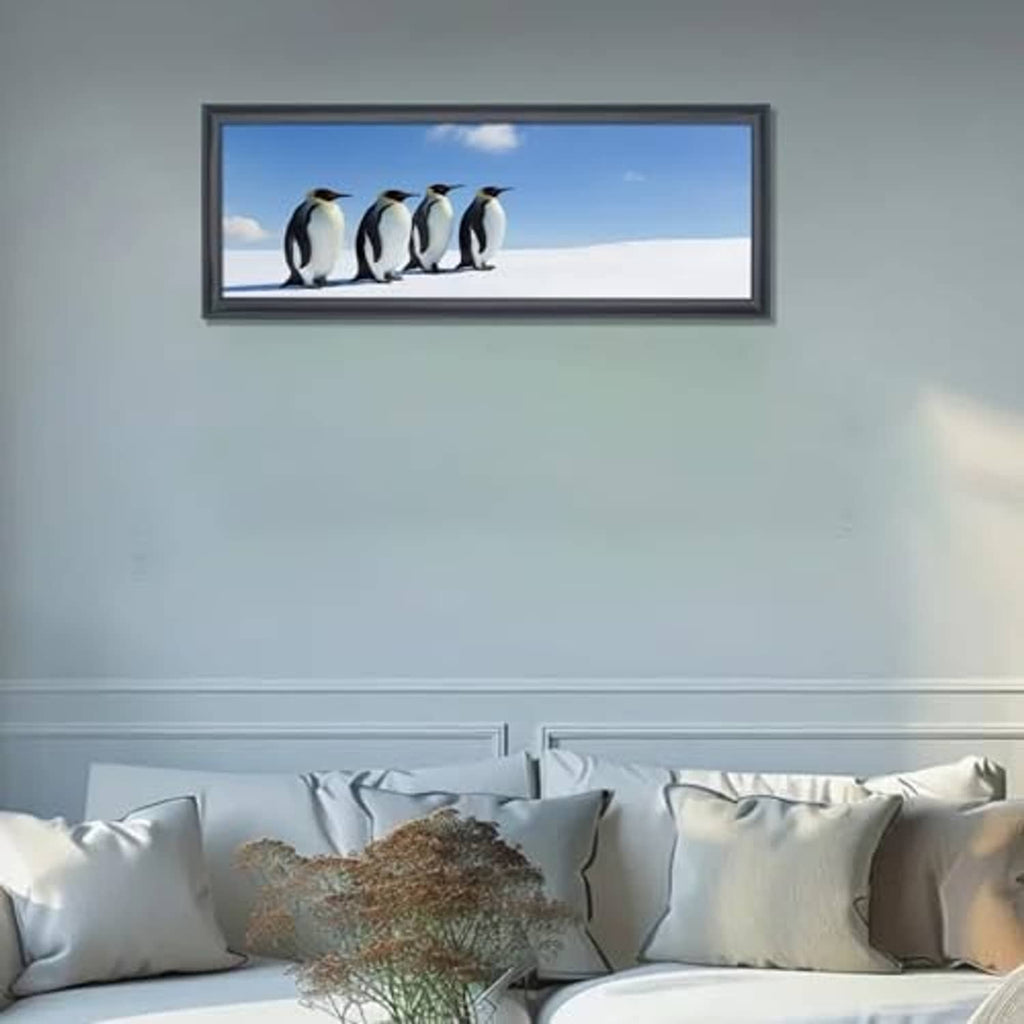 Black solid picture frame displaying a penguin photo on a wall