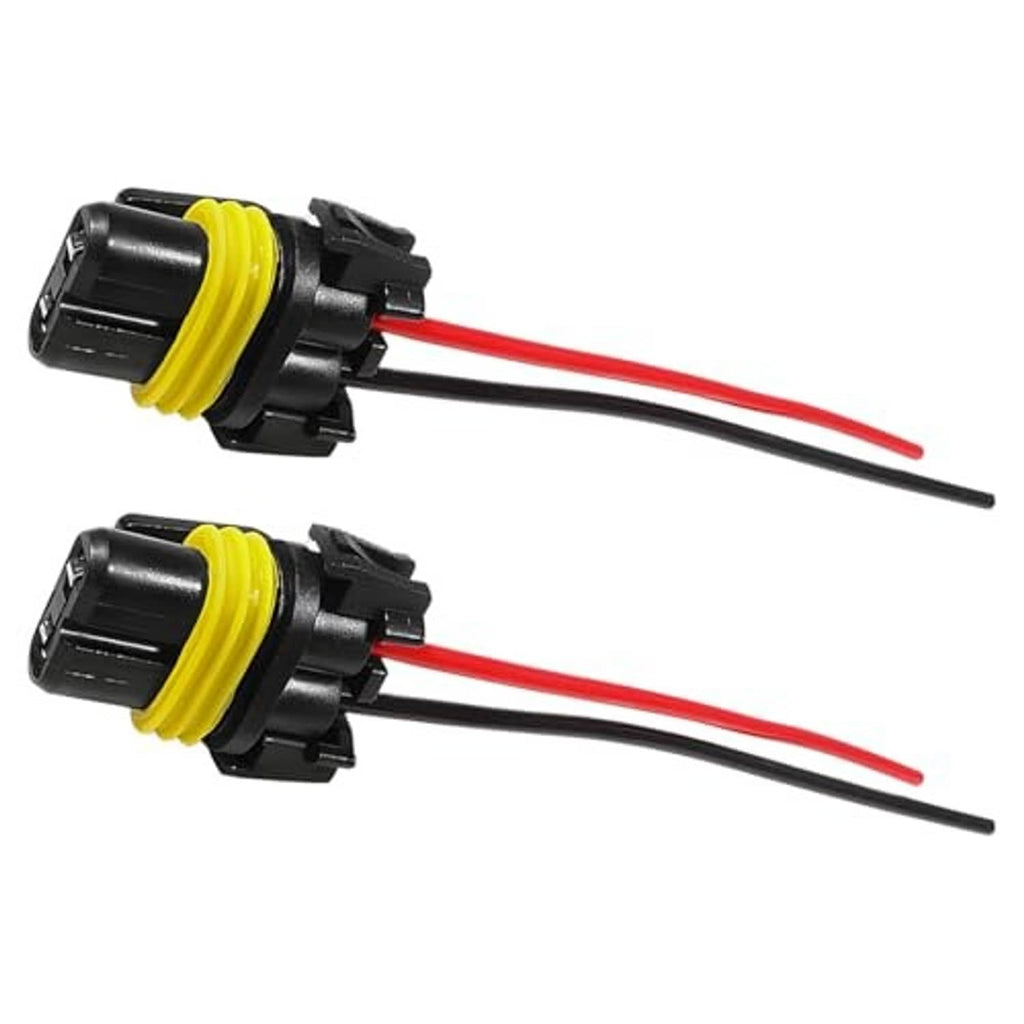Two headlight socket wiring harness connectors, yellow-ring plugs with red and black leads