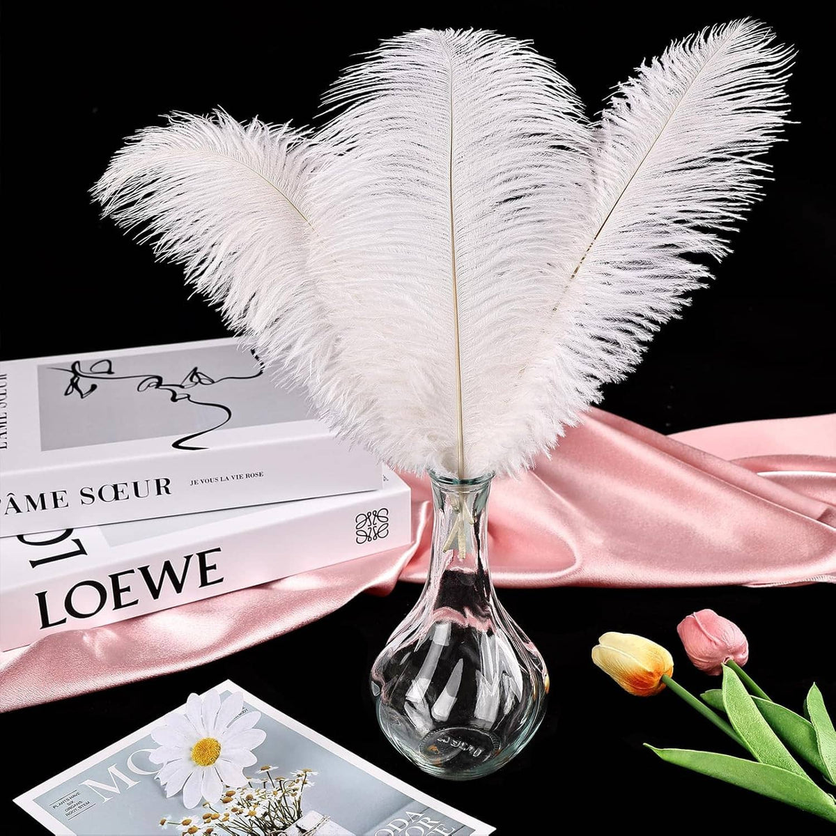 White ostrich feathers with layered long plumes and visible quills for crafts and decor