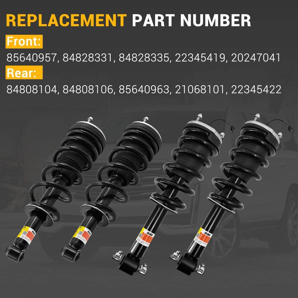 Four black shock absorber struts with coil springs and bottom mounting shafts