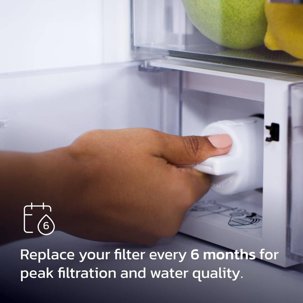 Refrigerator water filter being replaced by hand with white cartridge