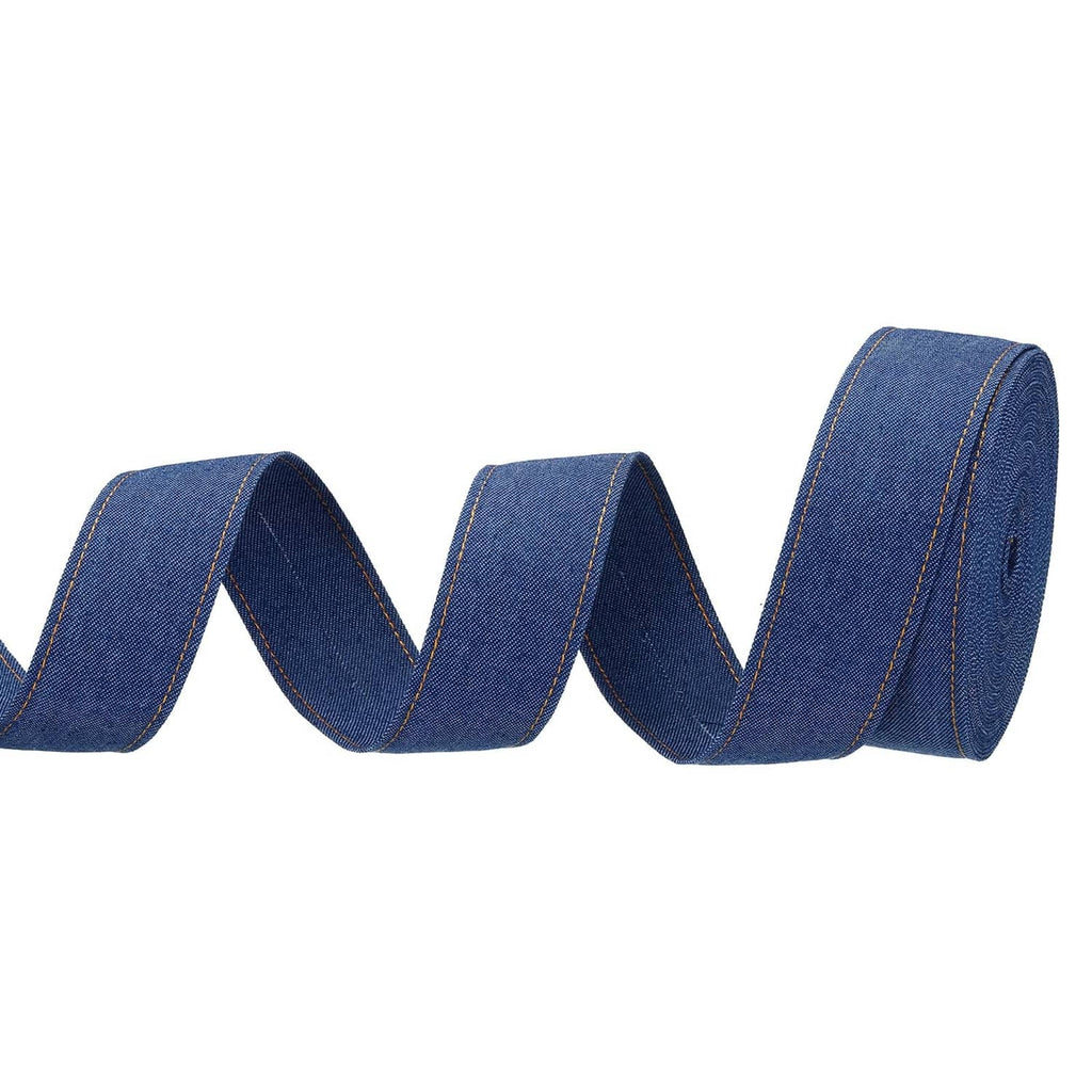 Dark blue denim ribbon strip with stitched edges, rolled and wavy