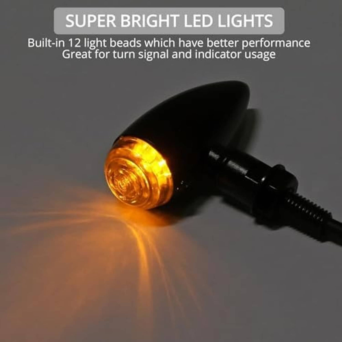 Amber bullet LED turn signal light in black housing with mounting screw and wire