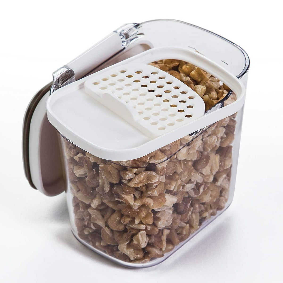 Airtight mini storage container filled with chopped nuts, open with snap lid