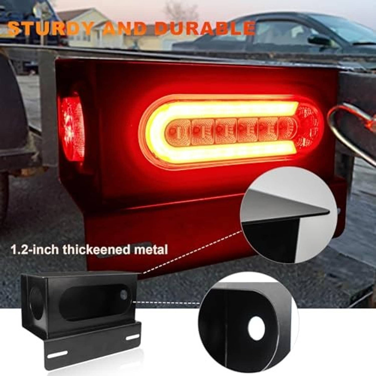 Oval LED trailer light glowing red with amber highlight, thick black metal housing