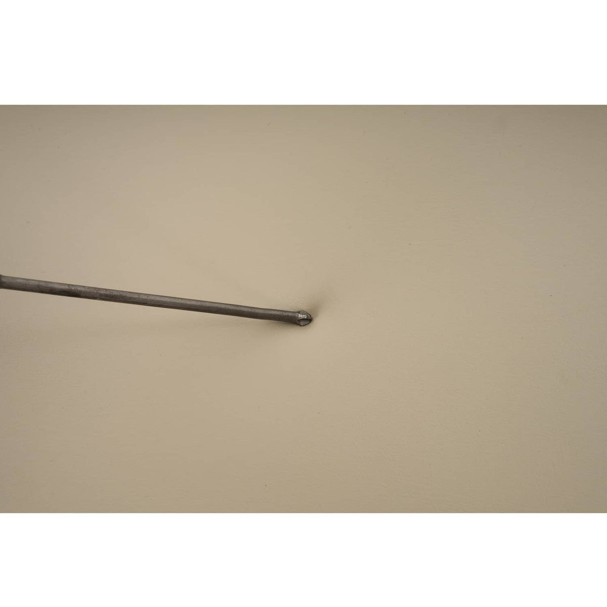 Tan cushion with metal support rod and mounting hardware detail