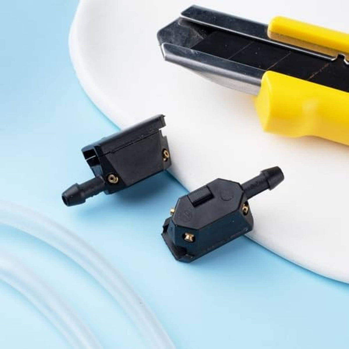 Washer nozzle adapters, black plastic housings with brass outlets, two-piece set