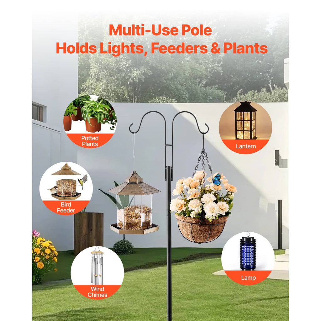 Black double-hook shepherds hook pole holding a lantern and a bird feeder