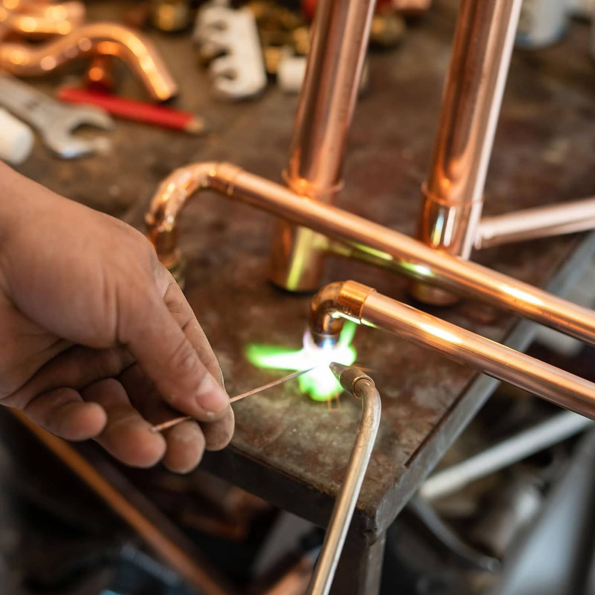 Copper pipe end caps installation on copper pipe ends with torch