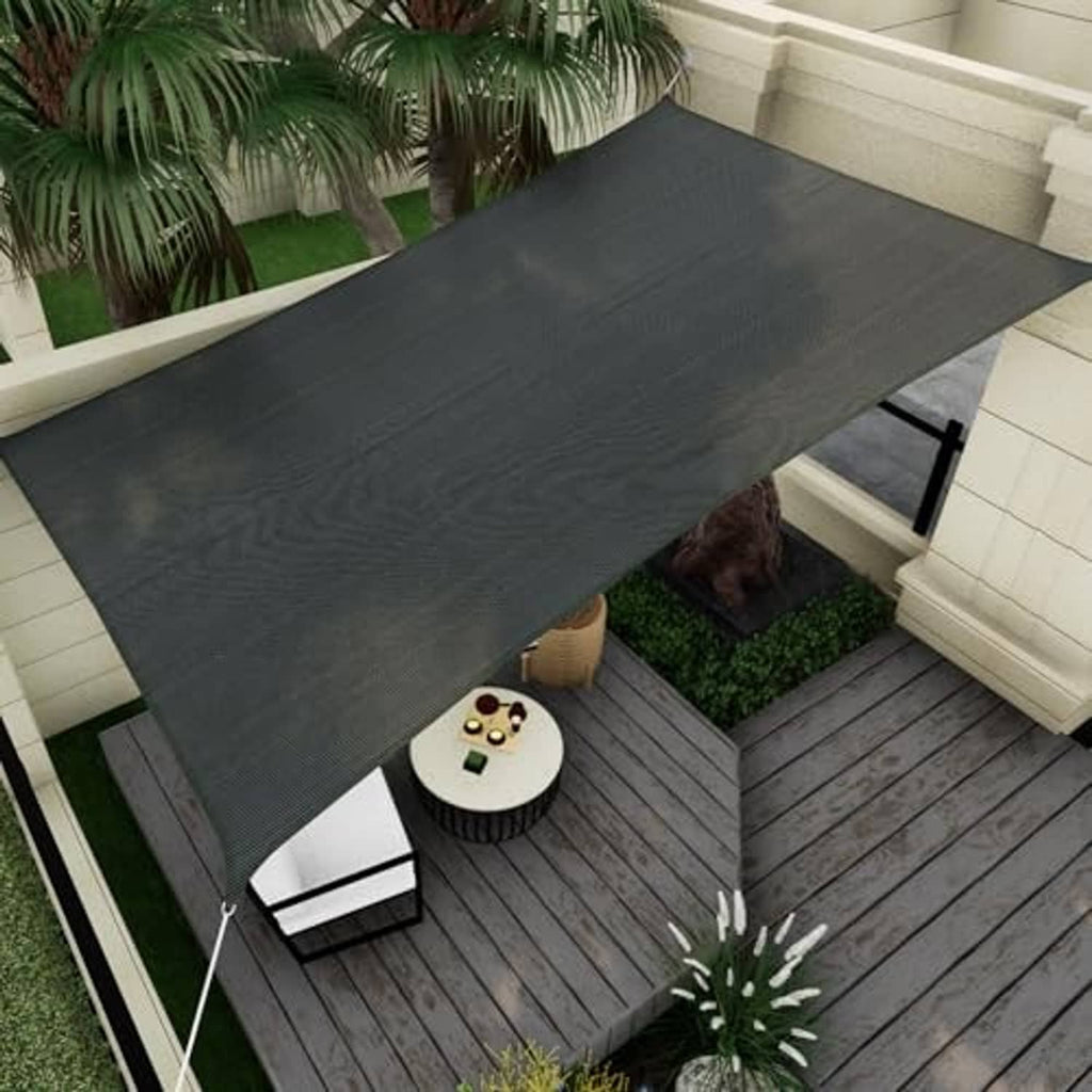 Rectangle shade sail canopy, dark gray, angled view over outdoor seating area.