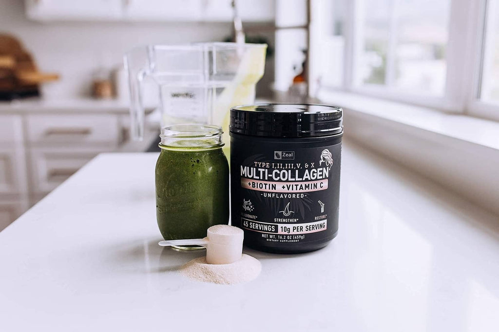 Multi-collagen peptides powder tub with jar of green powder on a countertop