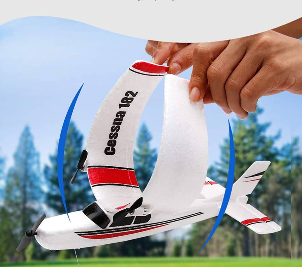 White and red RC airplane being assembled, hand lifting the wing