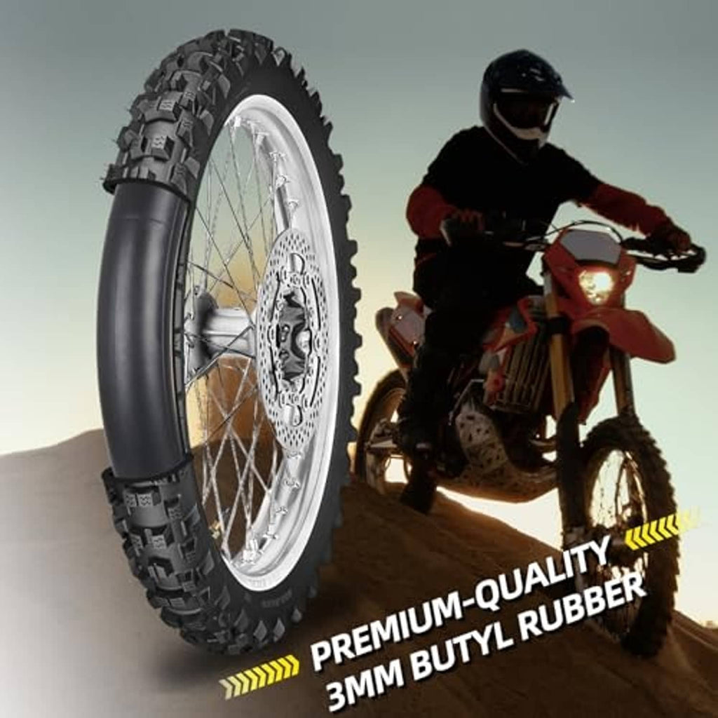 Black butyl motorcycle inner tube beside off-road motorcycle wheel