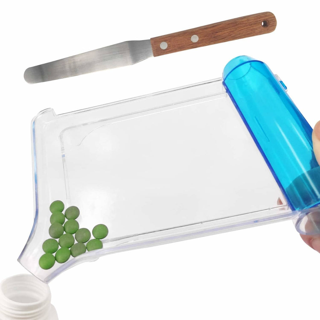 Clear pill counting tray with blue pusher and wooden-handled metal spatula