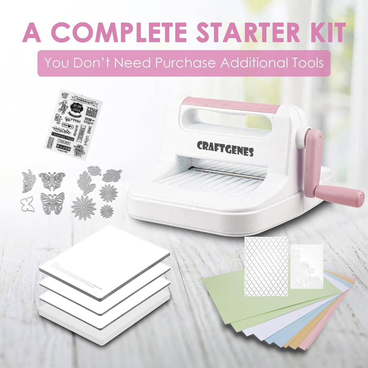 Die cutting and embossing starter kit with machine, pink handle, paper sheets and cut shapes