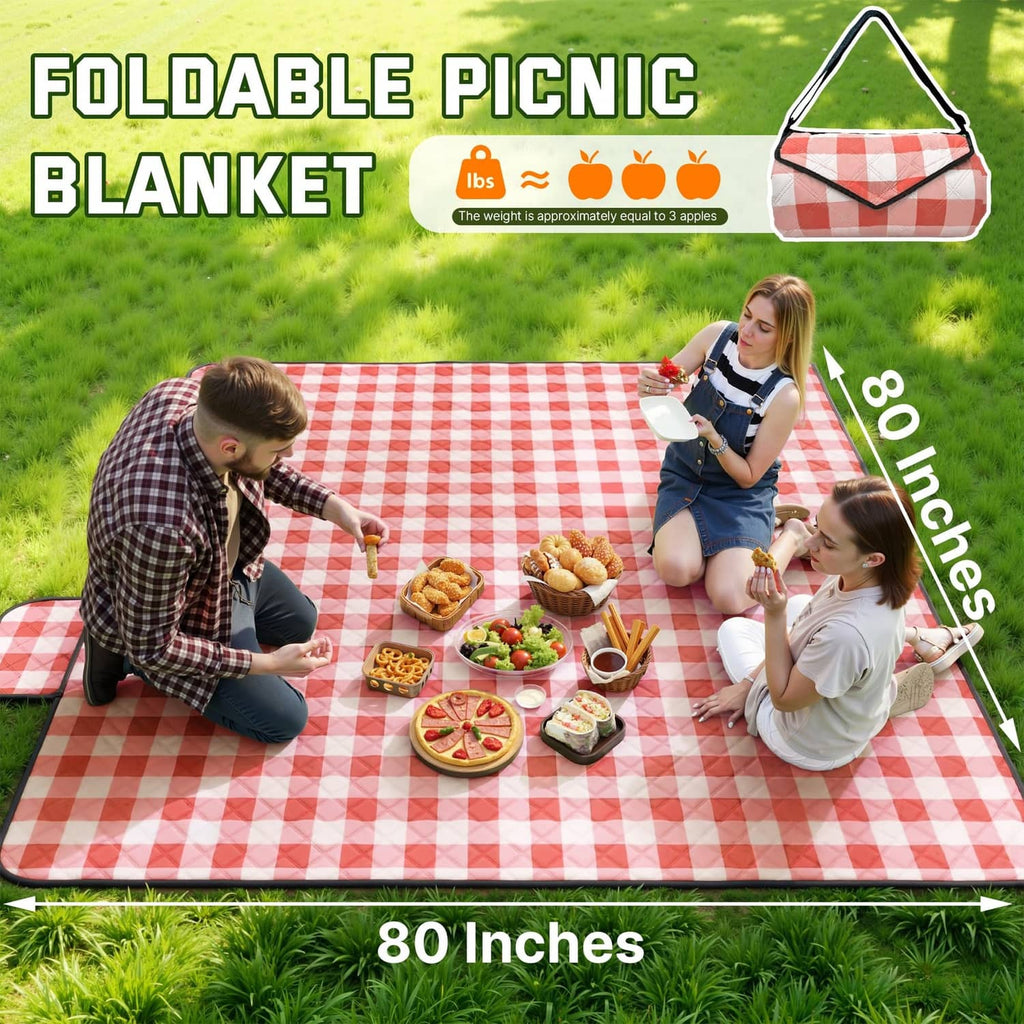Red-and-white check foldable picnic blanket spread on grass, rectangular design