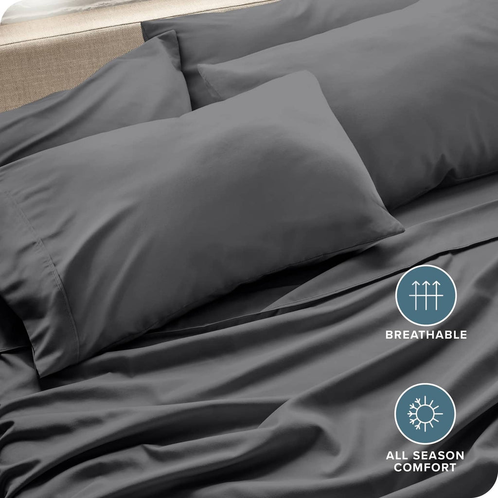 Grey pillowcases with soft microfiber weave, smooth surface on neatly made bed.