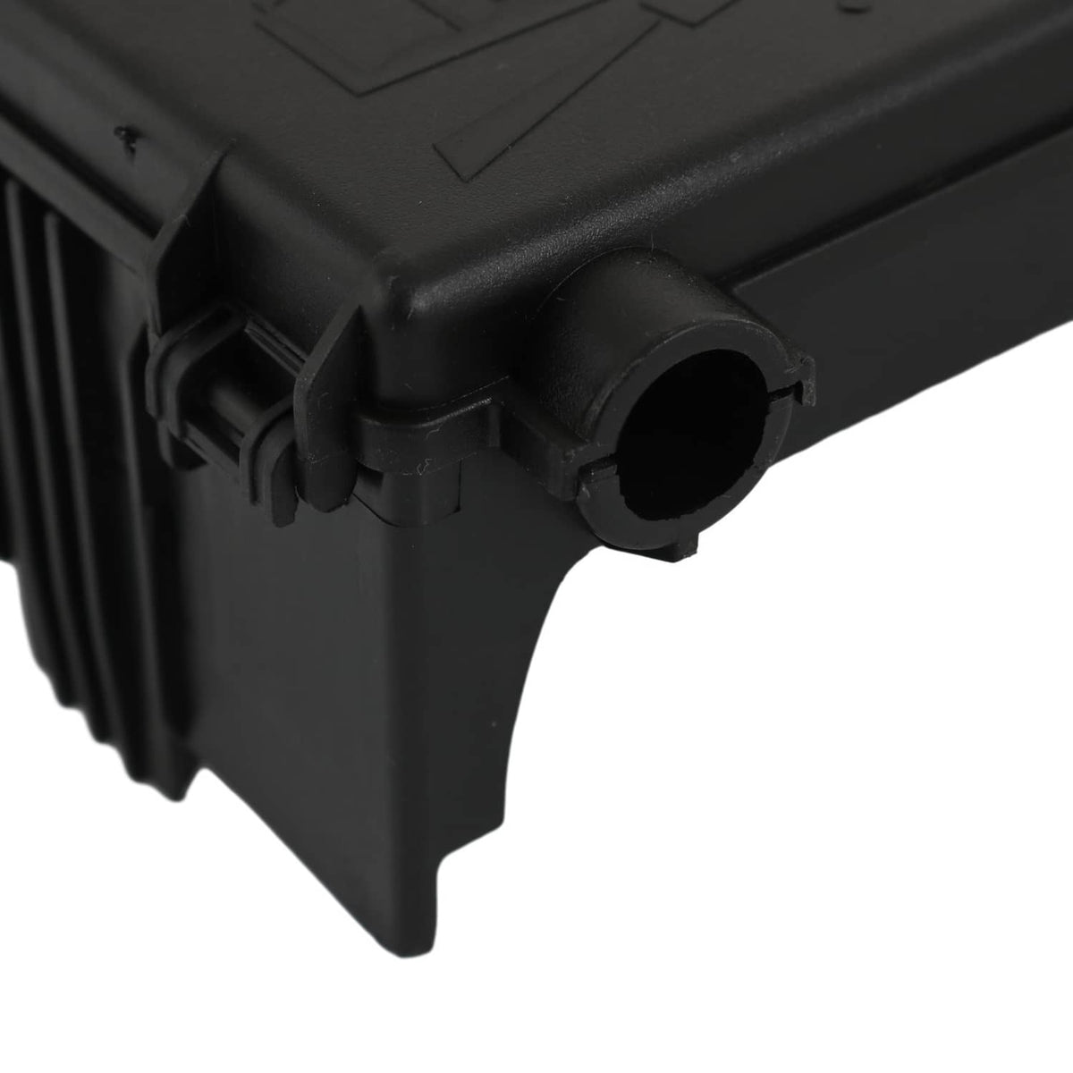 Black fuse block terminal close-up of molded housing with circular connector port