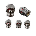 Set of five chrome skull tire valve stem caps with red eyes and rubber seals