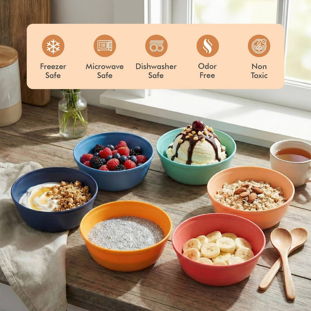 Colorful deep plastic bowls with spoons and desserts, blue, green, orange, and red.