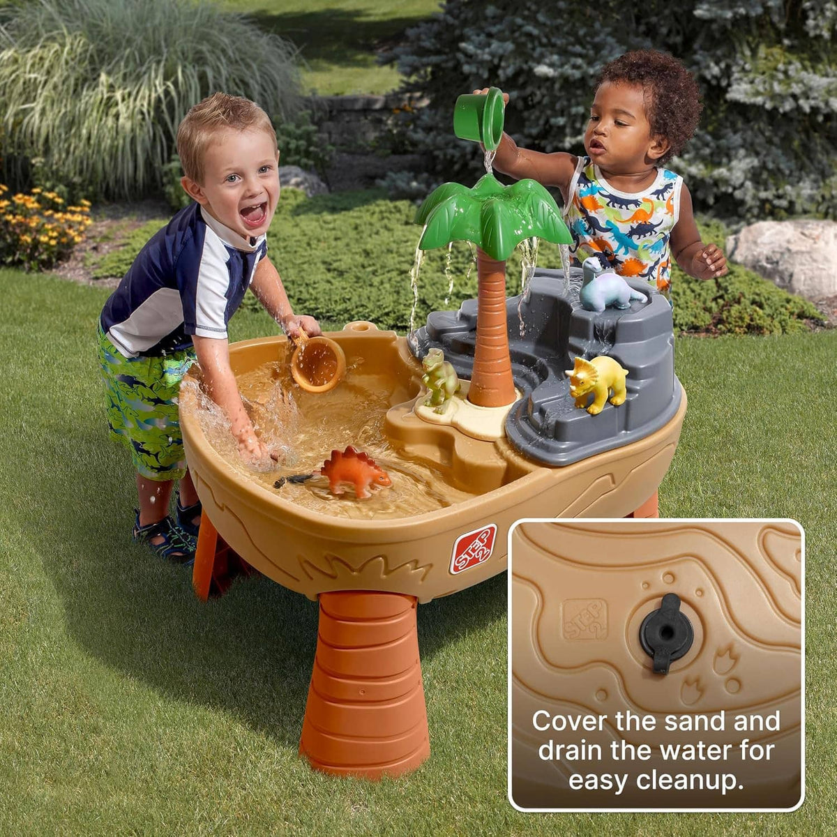 Kids dinosaur sand and water play table with green palm tree, tan basin and grey water feature