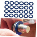 Blue oil drain plug crush washer set shown on an engine bolt thread