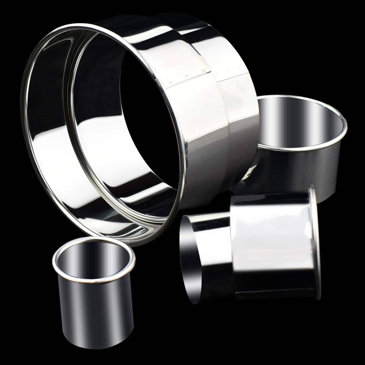 Nested stainless steel round cookie cutters with small cylinder cutter pieces