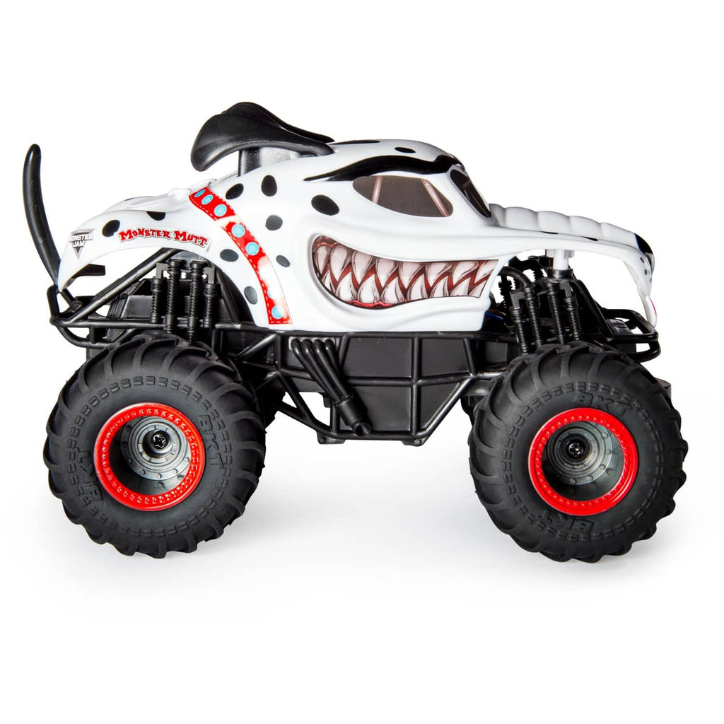 White dalmatian-style RC monster truck with jagged grin face and red wheel accents