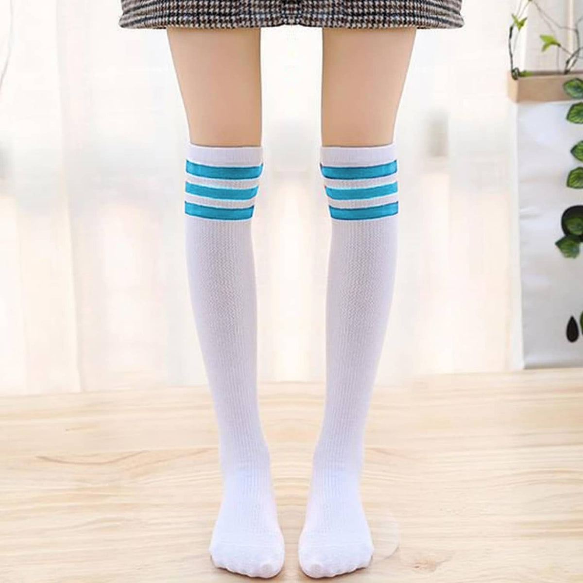 White over-the-knee socks with blue striped bands and ribbed knit