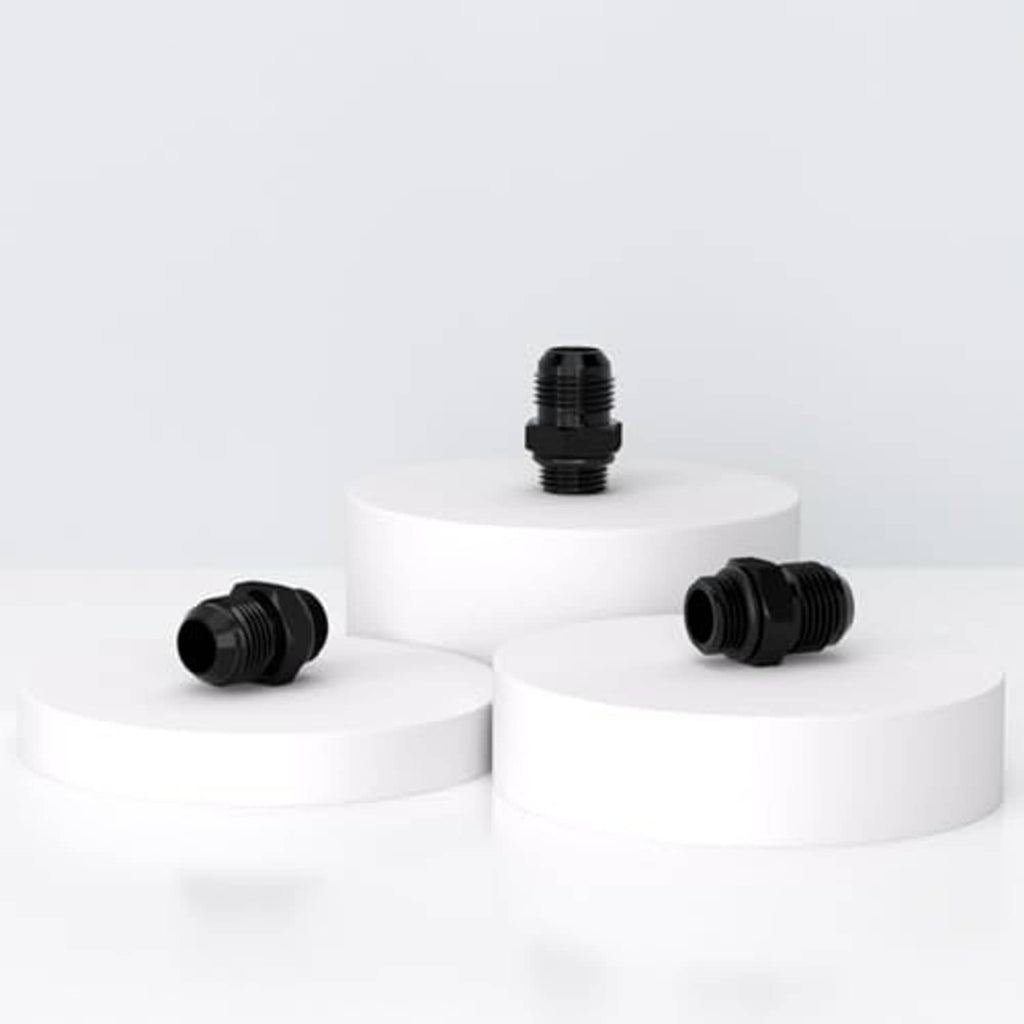 Black AN-style hose fitting adapter set on display blocks, threaded ends visible