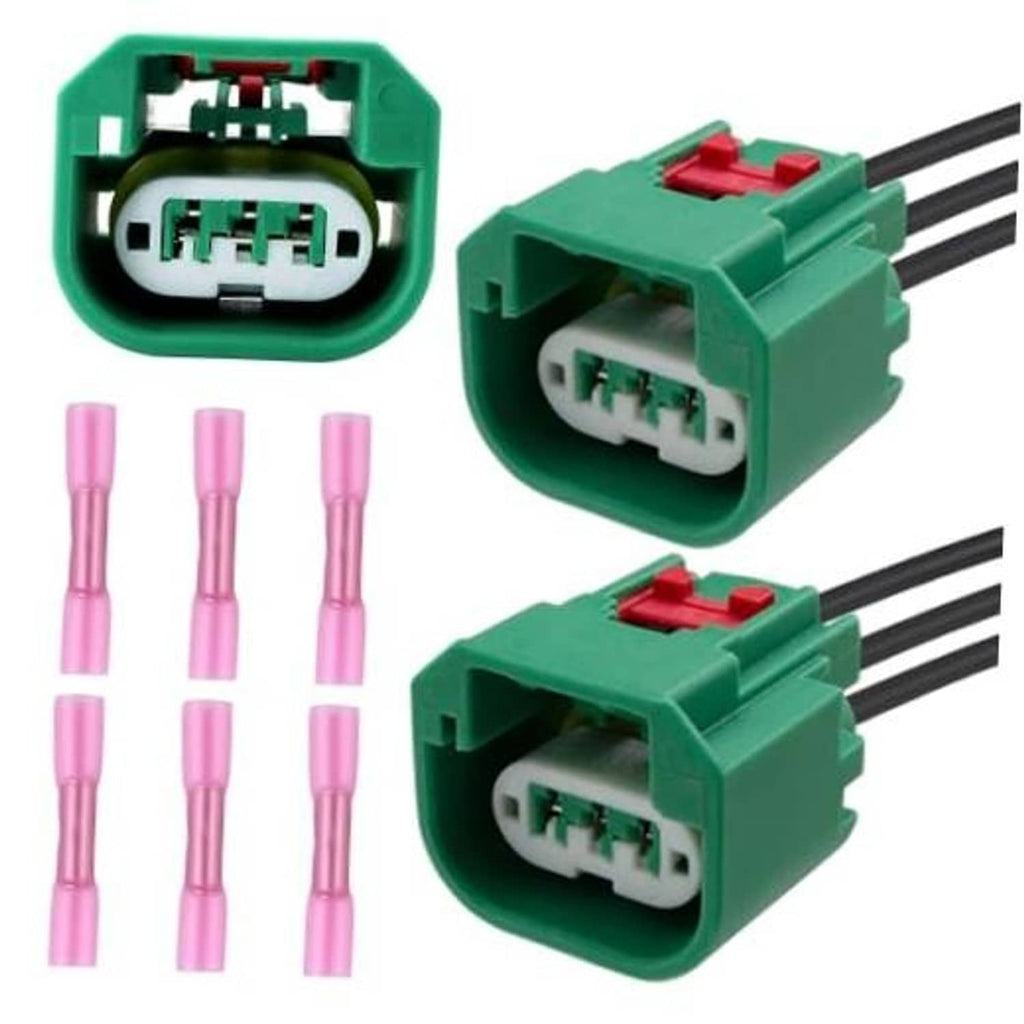 Headlight wiring harness connector pair with green housings, red latches, 6 terminals