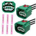 Headlight wiring harness connector pair with green housings, red latches, 6 terminals