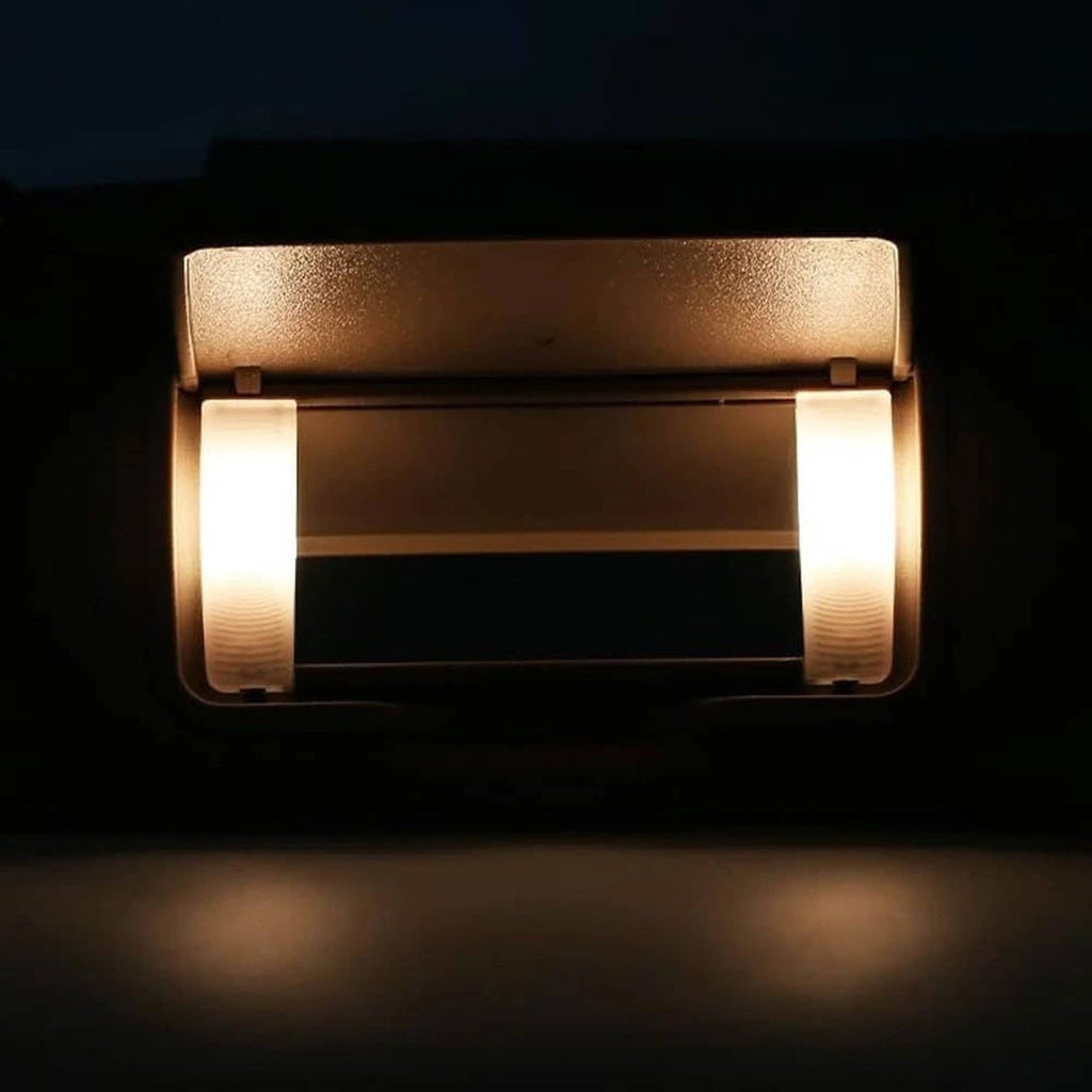 Close-up of tan sun visor LED mirror light panels turned on