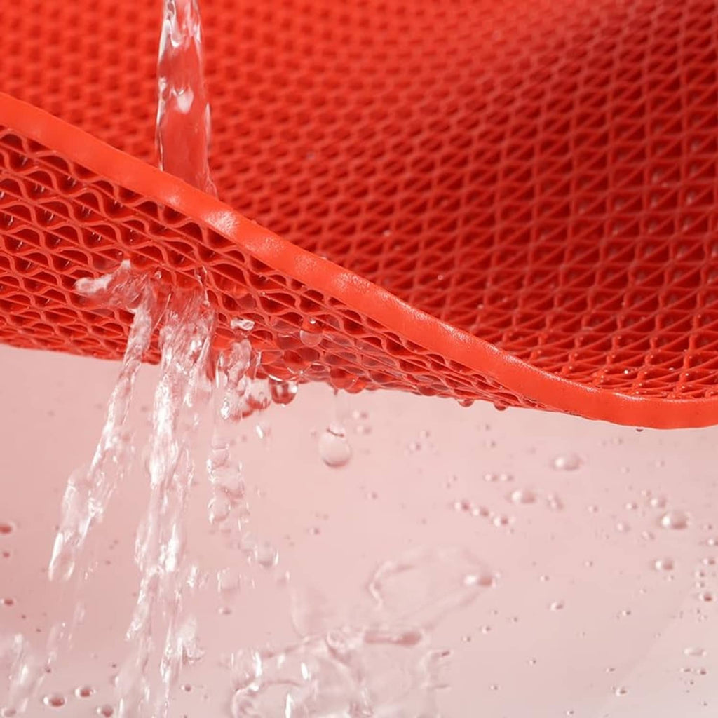 Red non-slip PVC mat with raised lattice texture and water droplets