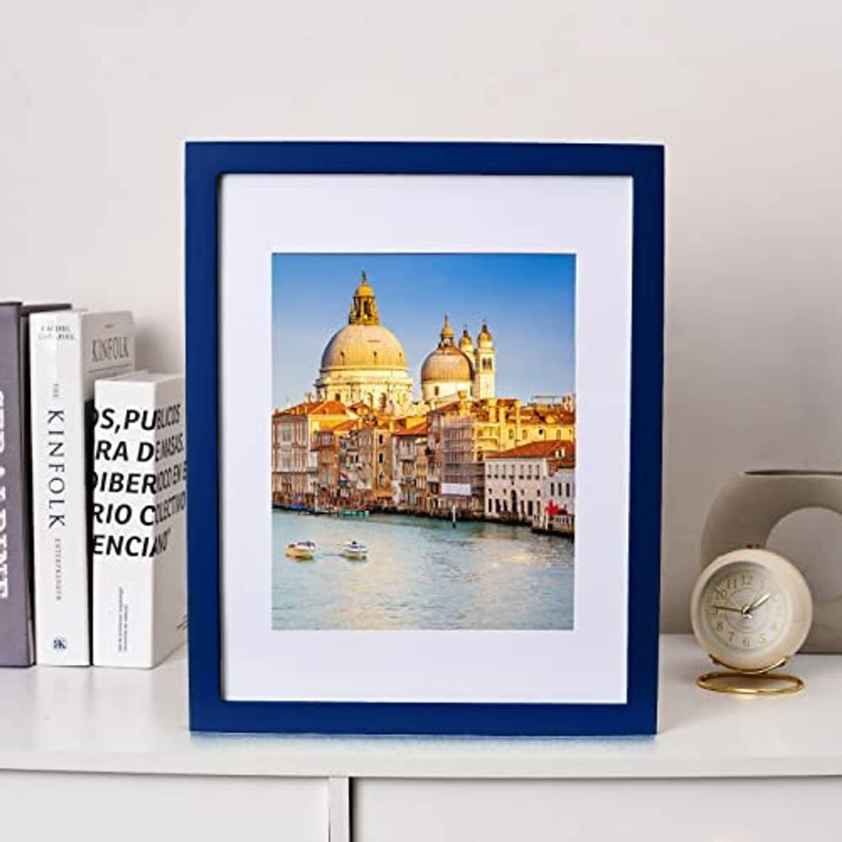 Dark blue solid wood 11x14 picture frame with white mat and city skyline photo