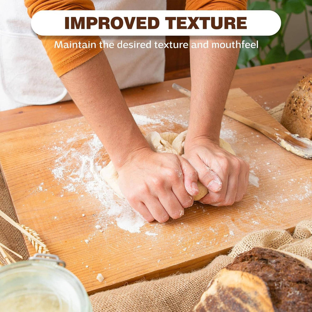 Potassium bicarbonate powder sprinkled on dough with hands on a wooden board