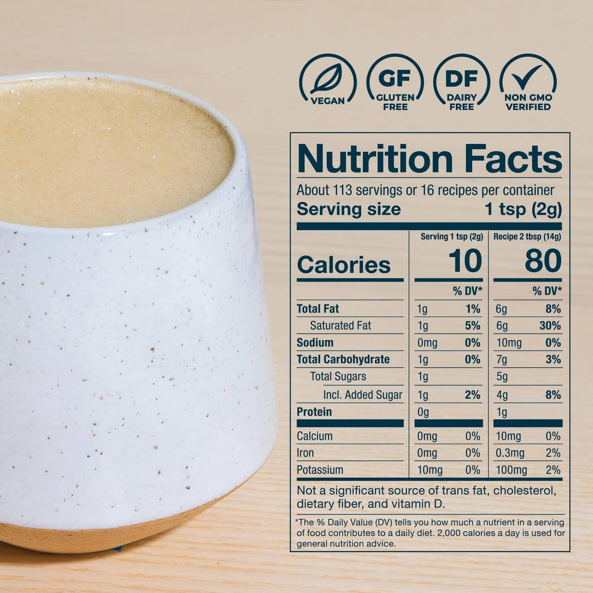 Coffee cup with beige creamer and close-up Nutrition Facts panel