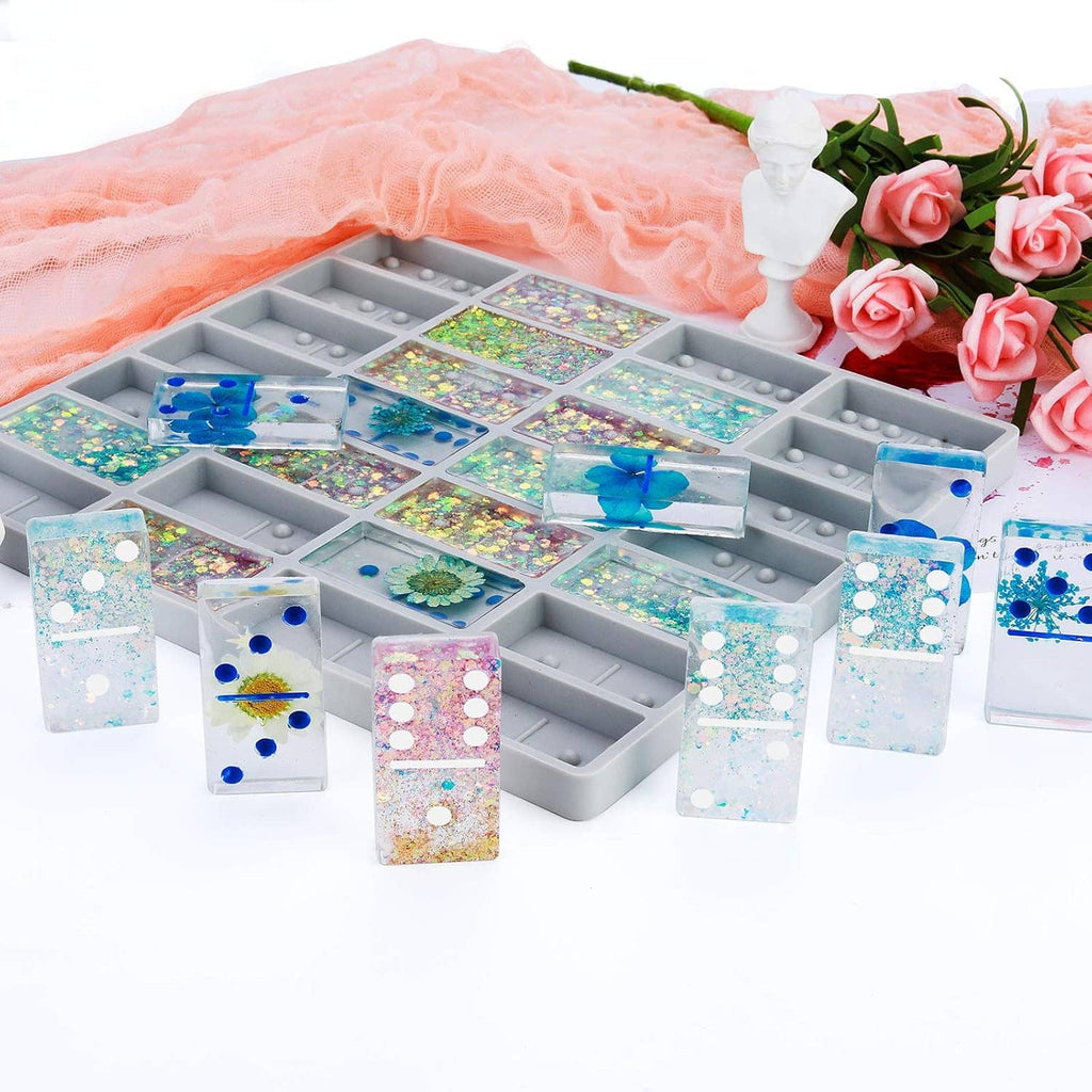 Jumbo domino silicone mold tray filled with glittery resin domino shapes