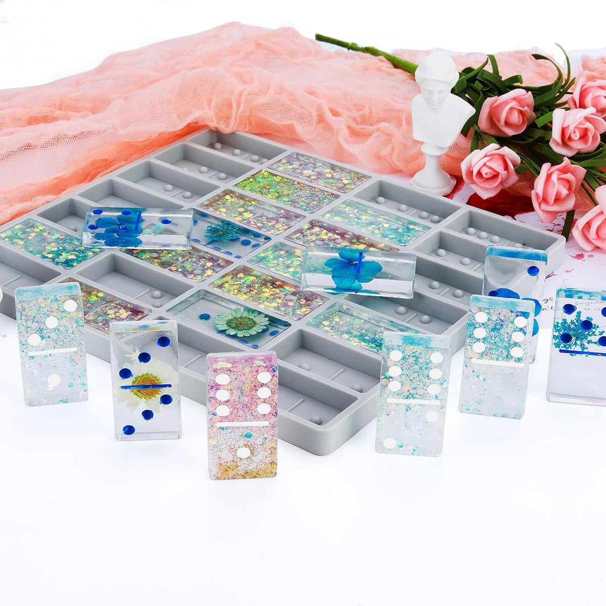 Jumbo domino silicone mold tray filled with glittery resin domino shapes