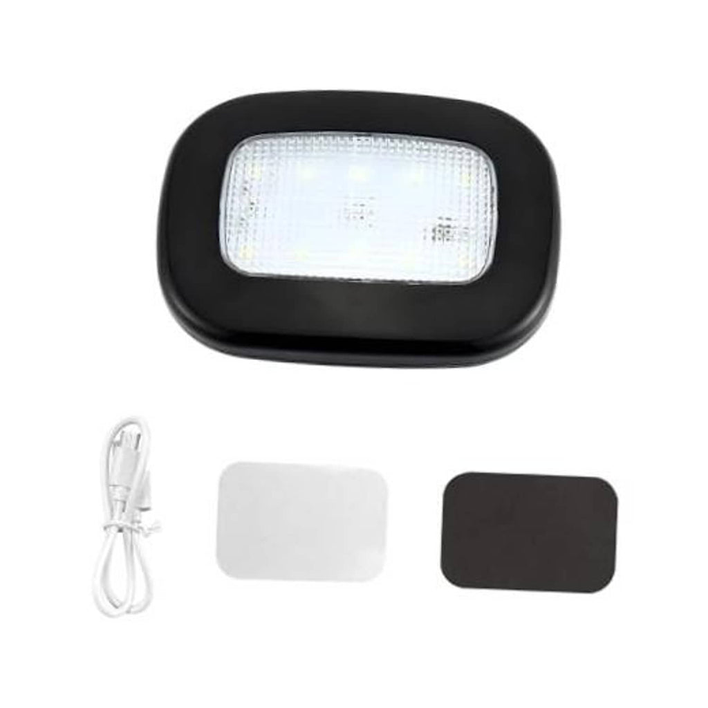 Black dome car reading light with glowing LED panel and USB cable and adhesive pads