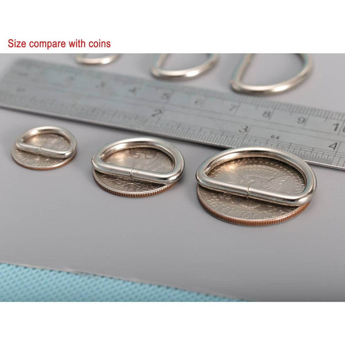 Nickel-plated D-rings with coin size comparison, metal loop buckles