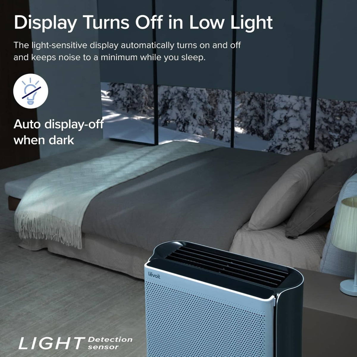 Silvery grey air purifier with dark display panel on top, low-light use