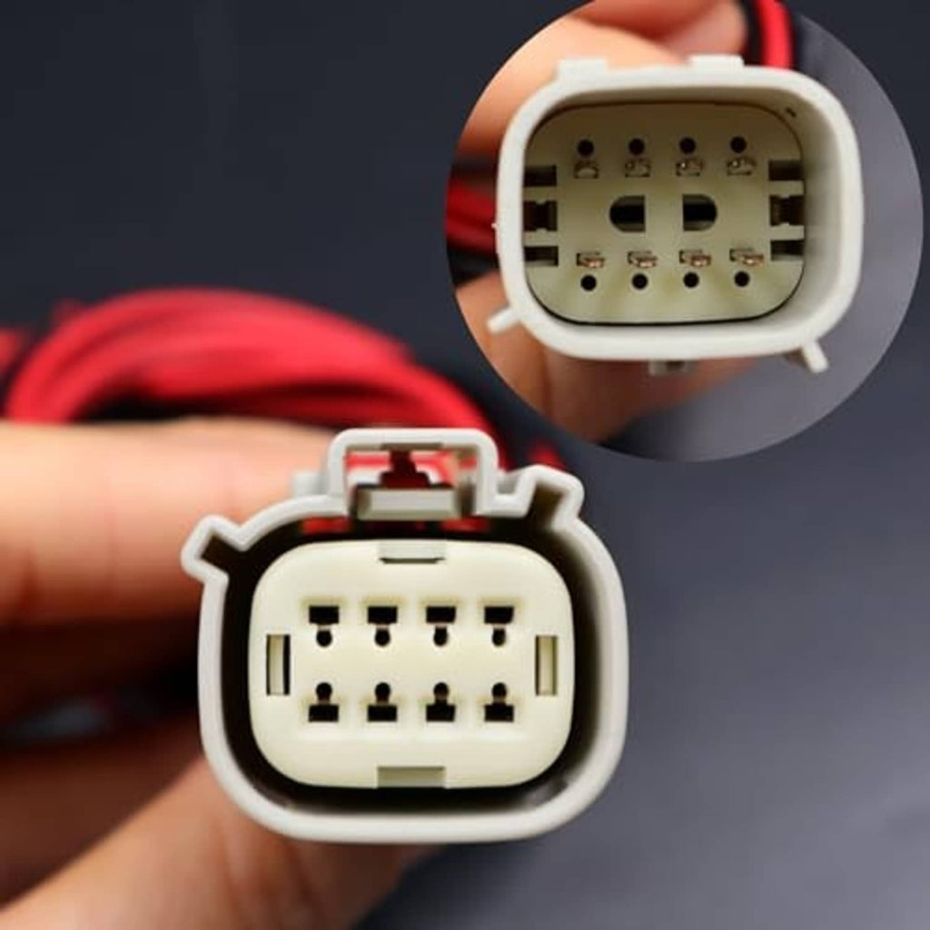 Multi-pin LED headlight connector plug with visible socket pins and red/black wires