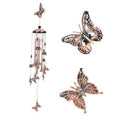 Copper-tone butterfly wind chime with hanging metal tubes and small bell accents