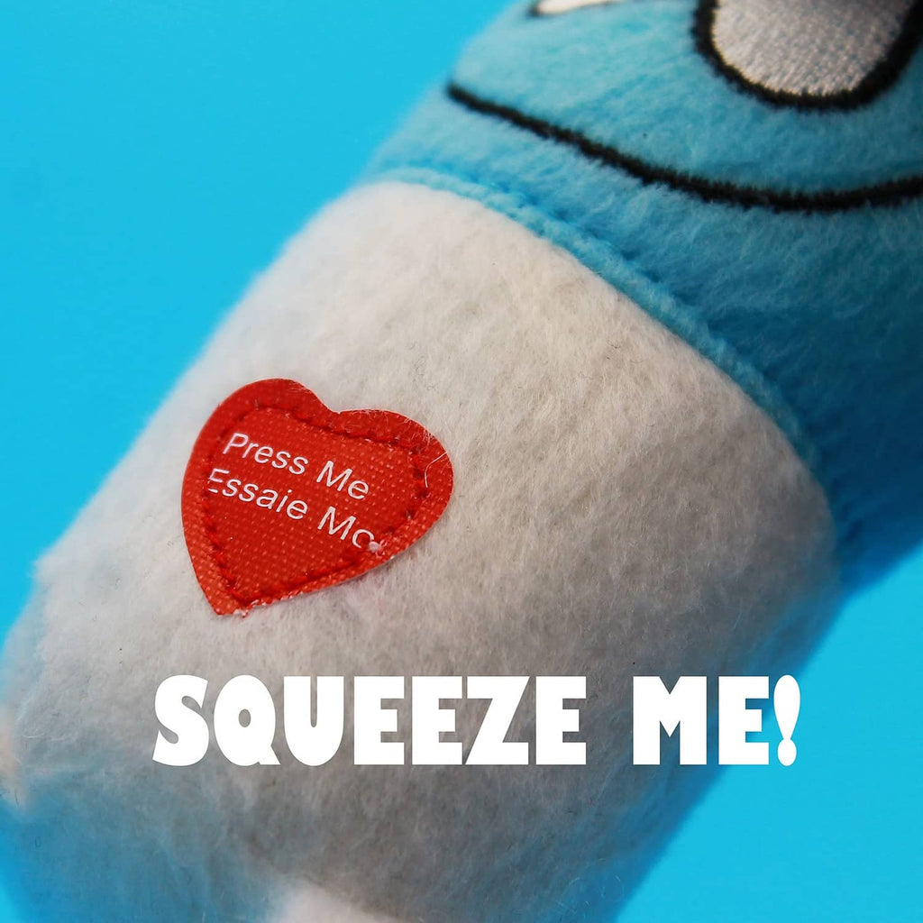 Blue Happy Pill plush close-up with red heart button reading press me