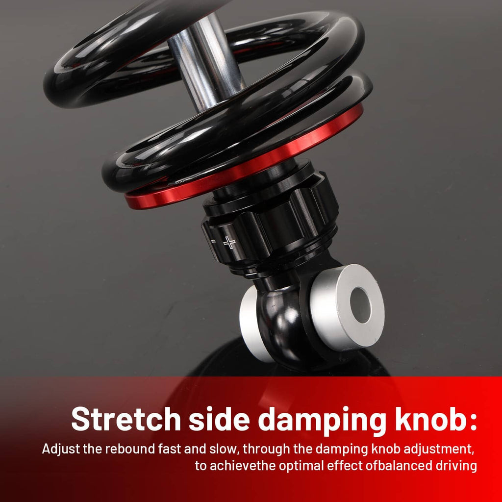 Close-up of black shock top with silver spring seat and red reservoir body