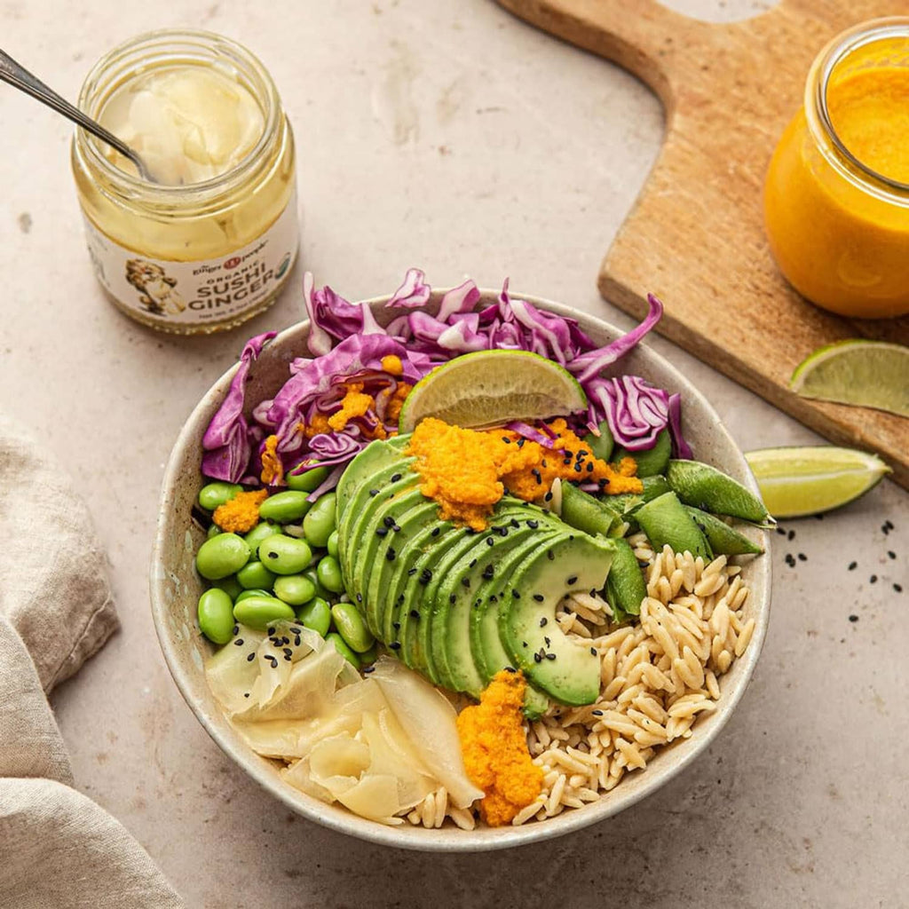 Bowl meal with avocado, edamame, shredded ginger, seaweed, and rice toppings