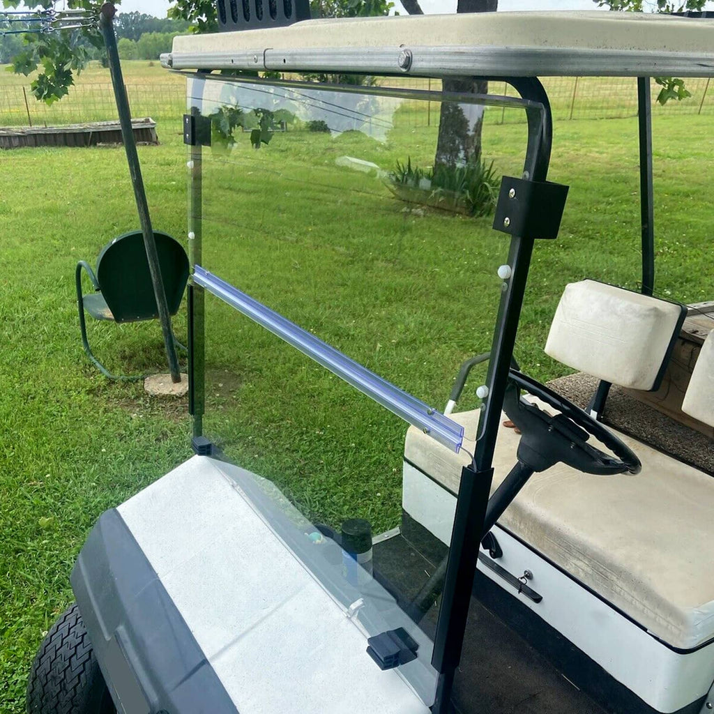 Golf cart with clear windshield and blue bar; black posts and brackets visible