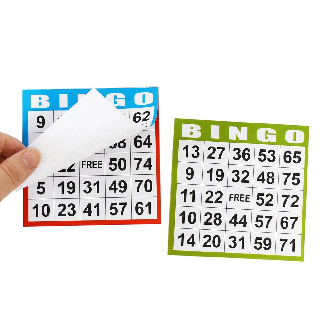 Hand holds overlapping blue and green Bingo cards with numbered squares and FREE.